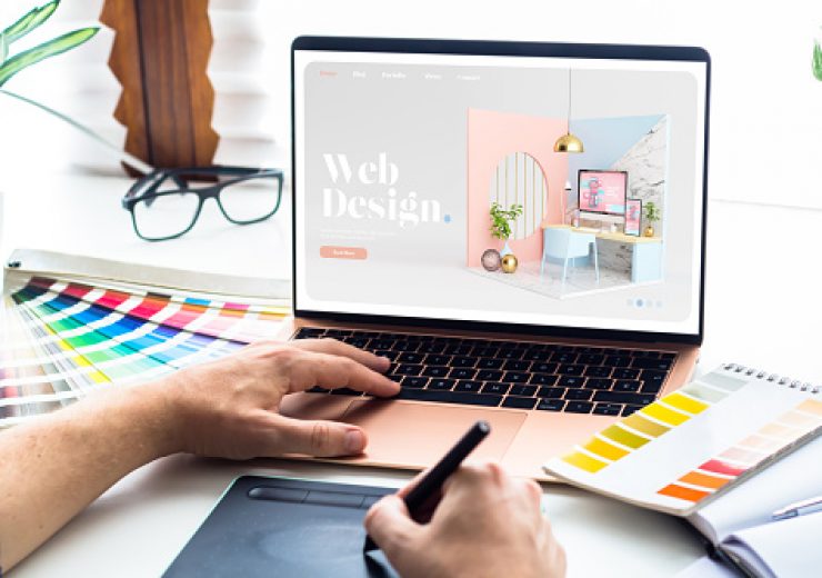 Web design desktop with  laptop and tools